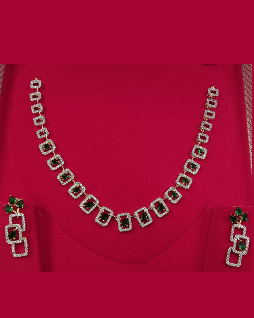Necklace set with green gemstones on a red fabric background